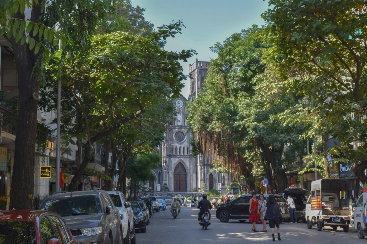 Evening light over a busy Hanoi Old Quarter street